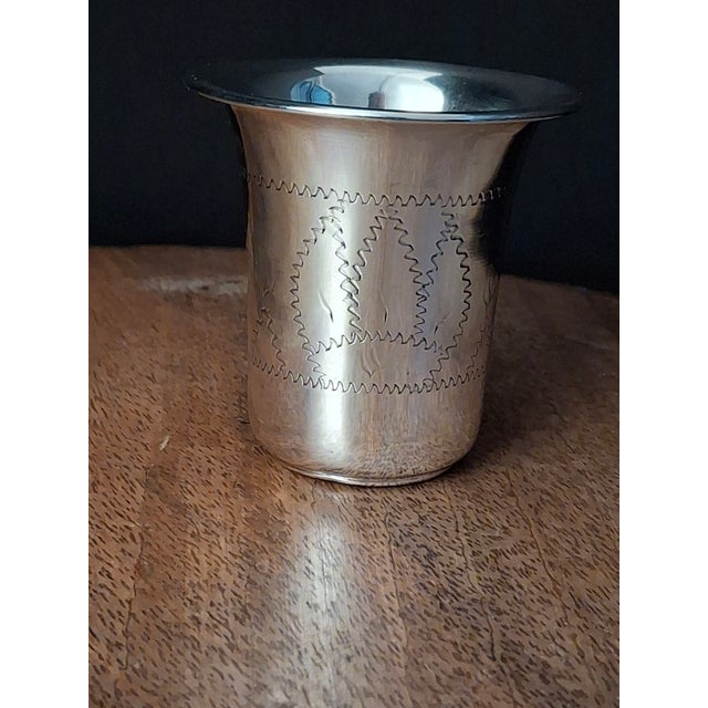 This vintage Jewish ritual Kiddush beaker is crafted from solid sterling silver, featuring a flared lip and classic...