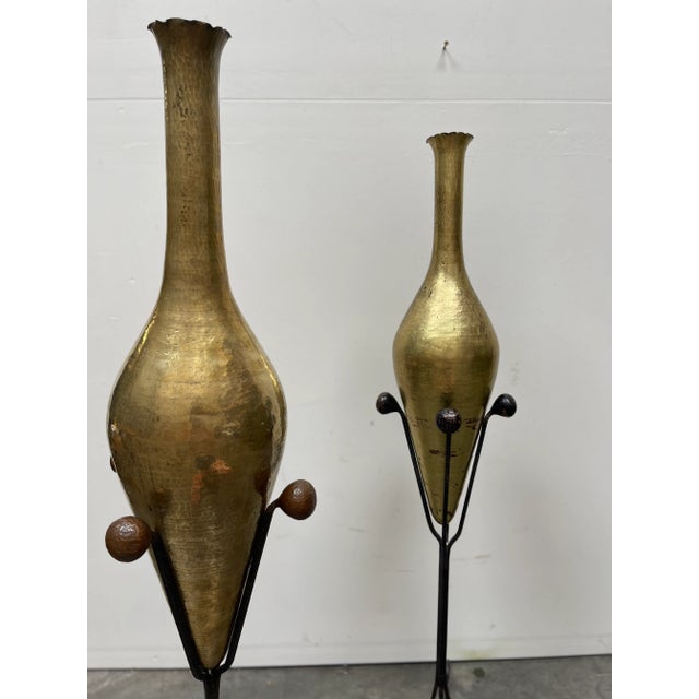 This is a pair of Aesthetic gilt hammered copper vessels on wrought iron stands circa 1910.