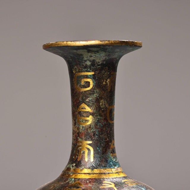 This striking vintage bronze vase is a beautiful example of Chinese archaistic metalwork. Crafted from bronze with a rich,...