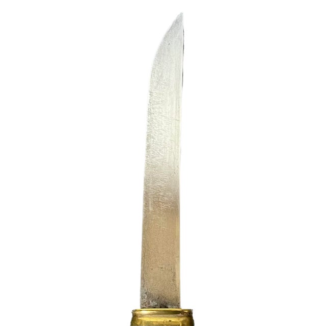 Vintage brass hunting knife with brass sheath. Brass handle and sheath are decorated with brass bird, game, and botanical...