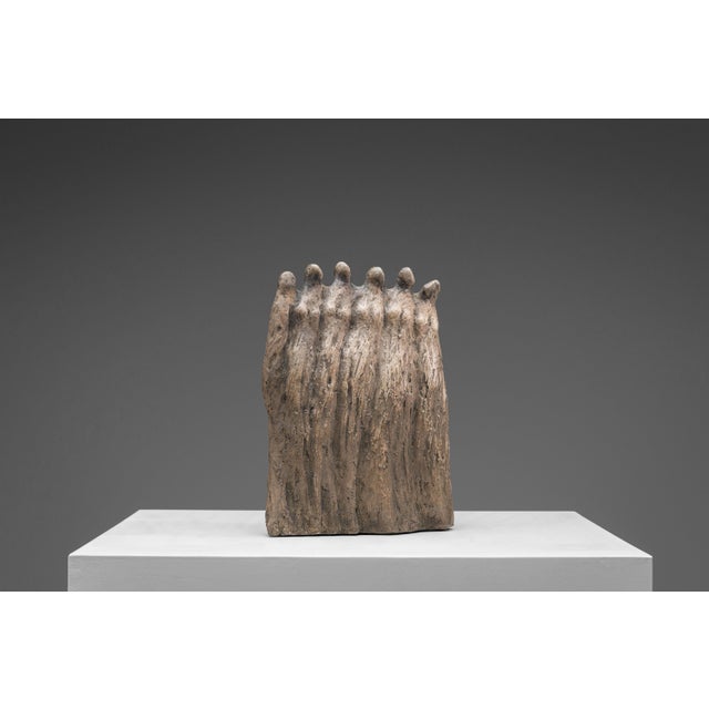 This striking vintage stoneware sculpture presents a closely grouped procession of six elongated female figures, standing...