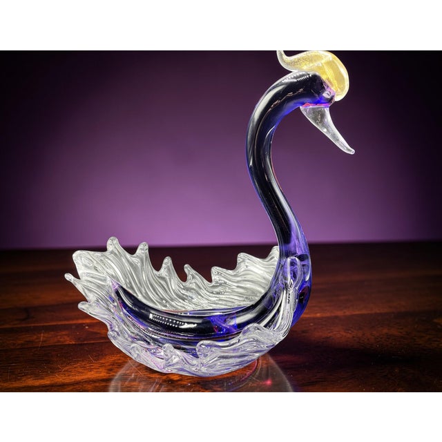 An elegant purple bowl by acclaimed Murano glass master Archimede Seguso. This refined piece is not only a functional...