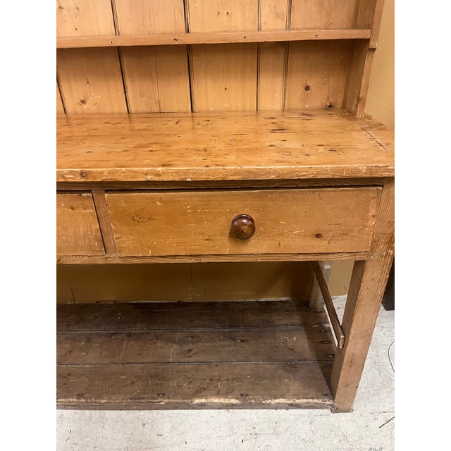 Old pine hutch 2 pieces. 3 drawers with old wooden screw knobs and open bottom for display. Top is 55” and bottom is 36” tall