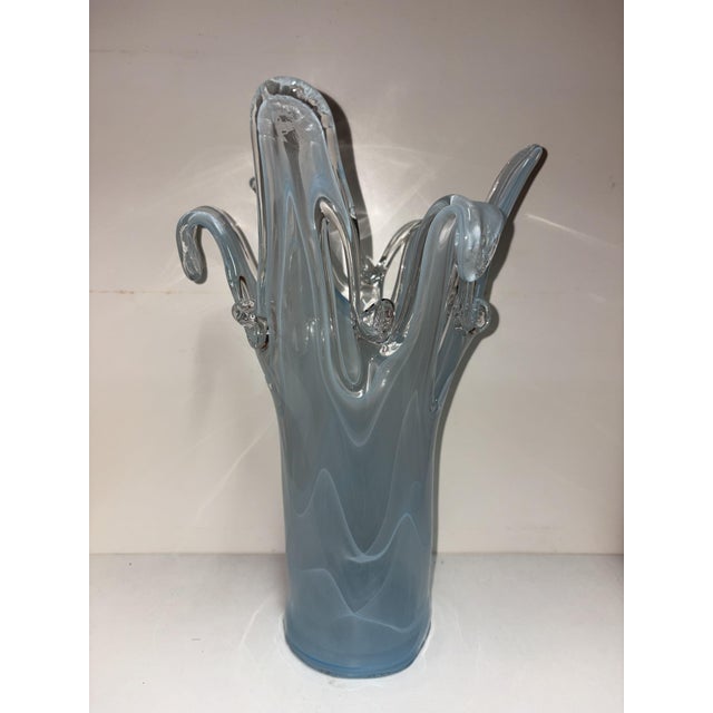 An elegant sculptural vase in artistic blue Murano glass, featuring a worked and shaped top with wavy tips. Height: 36 cm,...