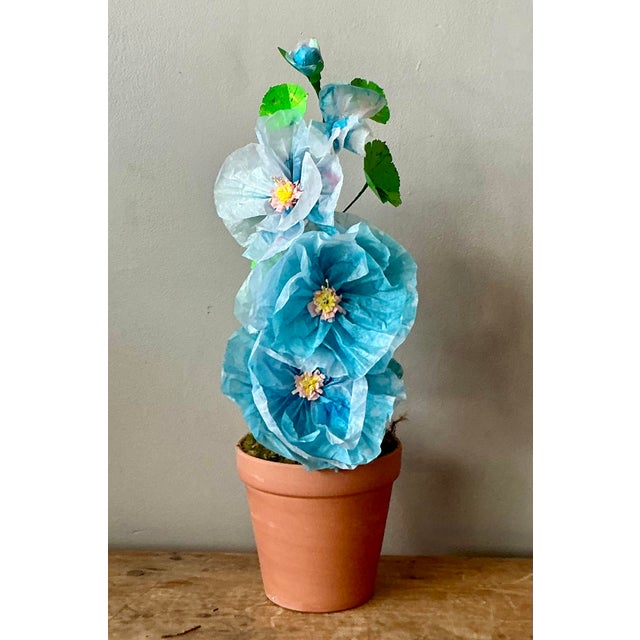 Contemporary hand-rolled paper flowers are a modern, artistic take on traditional floral arrangements. These flowers are...