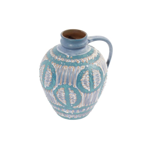 A West German ceramic fat lava jug produced by Cartsens Tönnieshof. This jug features a rounded shape with a narrow...