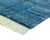 The blue city, rendered in wool — deep, luminous, and quietly geometric. This hand-knotted wool rug immerses the eye in a...