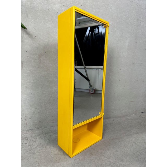 Yellow medicine cabinet or bathroom cabinet by Olaf von Bohr for Gedy. Vintage design. Italian. 1970s. Modular (door...
