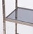 Chrome Hollywood Regency faux bamboo étagère with five gray glass shelves, circa 1970s. Please note of wear consistent...