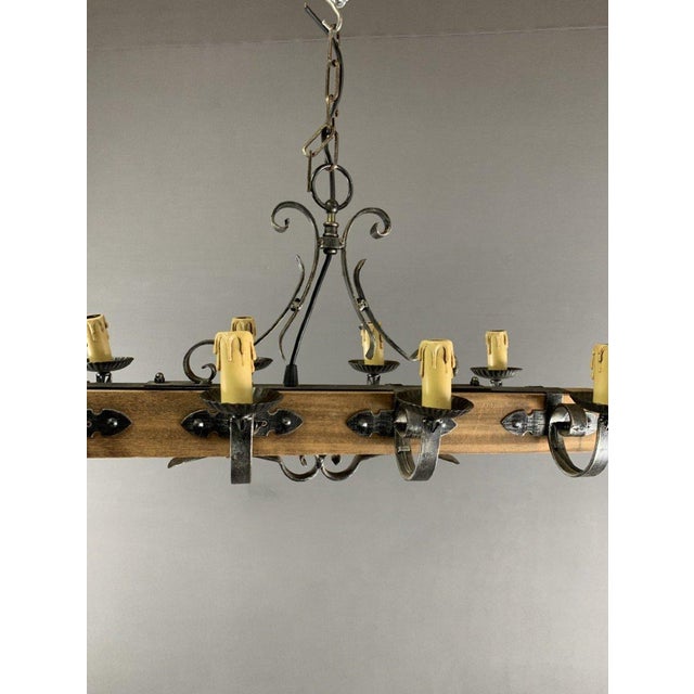 Rustic Wood and Metal Pendant Light with Artificial Candles Featuring a perfect fusion of natural materials and...