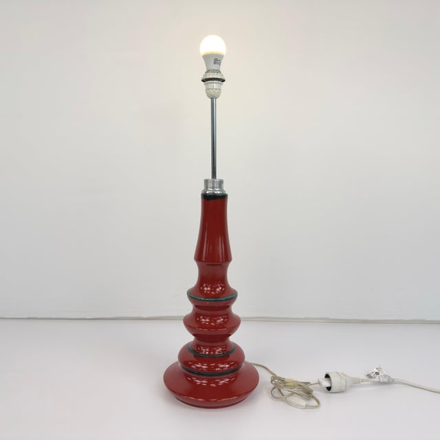 Dimensions: H 32” x W 10” Vintage German table/floor lamp with red ceramic base and beige fabric lampshade. Please see our...