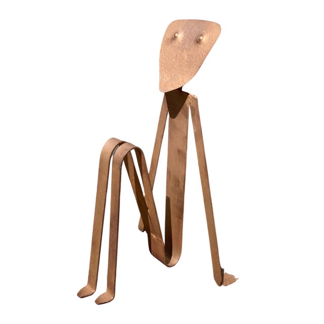 Fabulous vintage artist made magazine rack, in the shape of the seated figure. Magazines and small books go between his...