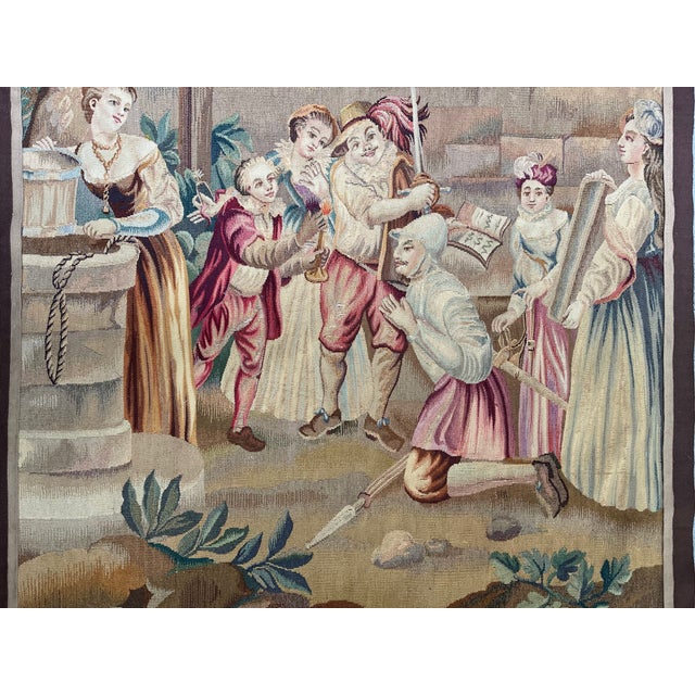 A 19th-century wool and silk tapestry, measuring approximately 42 x 38 inches. The tapestry depicts a pastoral scene. An...