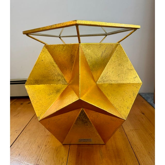 Dramatic "Iona" side table by the New York design house "Safavieh features very angular faceted reminiscent of the facets...