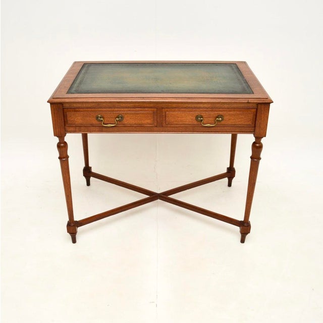 A superb antique Victorian walnut leather top desk / writing table. This was made in England, it dates from around the...