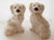 Pair of vintage Foo dogs. White glazed ceramic with black, red and gold accents.
