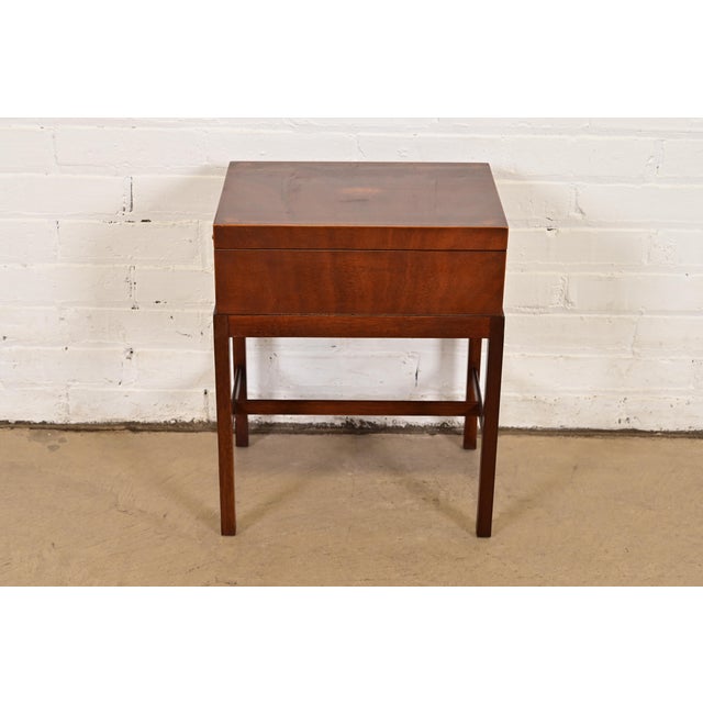 A gorgeous Georgian or Federal style chest on stand or occasional side table By Baker Furniture USA, Late 20th Century...