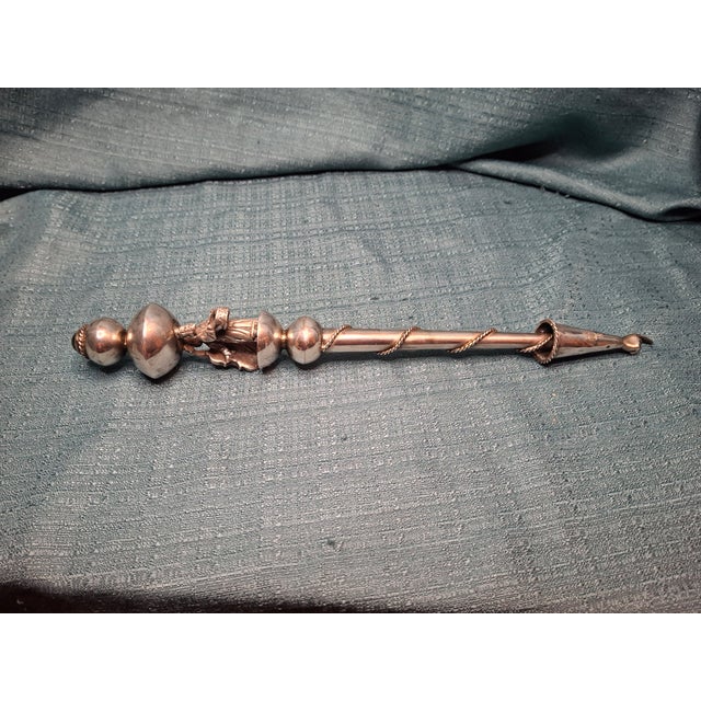 This exquisite antique Torah pointer, known as a Yad (Hebrew for "hand"), is a ritual object used in Jewish synagogue...