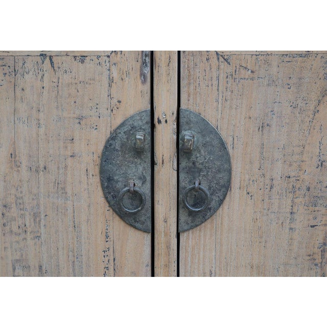 Antique Chinese Pine Hall Cabinet, in a beautiful old pine patina, with split "moon" hardware on the doors. A collector's...