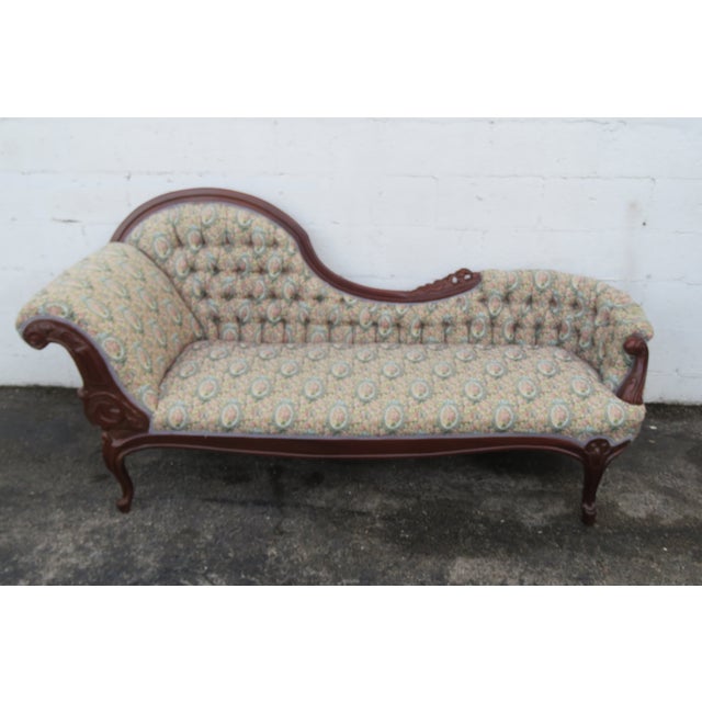 This gorgeous Chaise lounge is made of wood, solid mahogany, and tapestry. This classic chaise lounge was made in the Late...