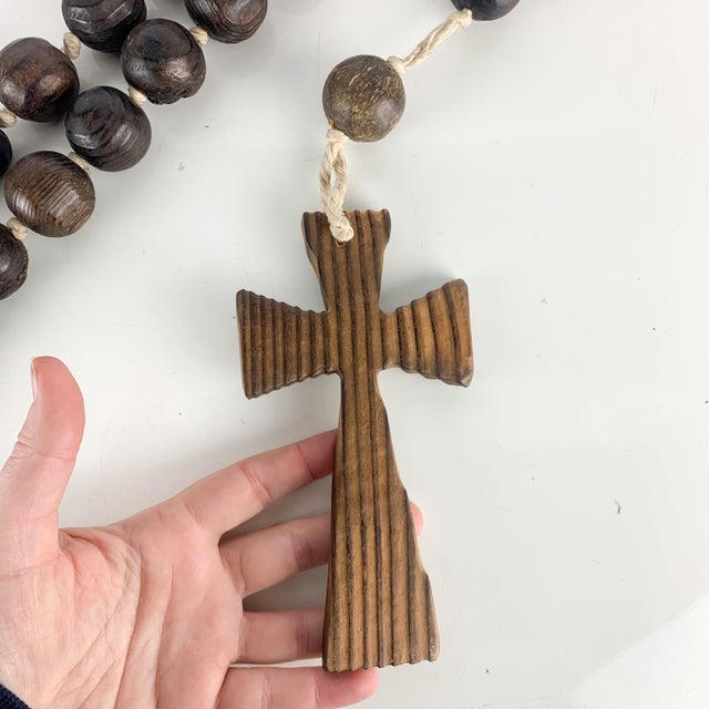Large vintage wooden rosary / prayer beads with cross and heart. Over five feet long. Love the texture of the beads. Great...