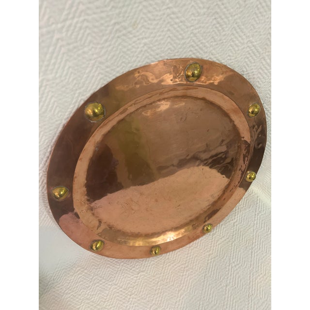 This copper tray is presumed to be from Mexico, though there is no mark. It is heavy and solid with decorative brass...