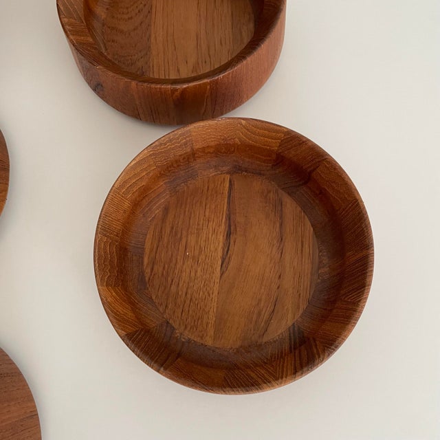 A set of salad bowls by Danish designer Jens Quistgaard for Dansk design. The set includes 8 serving bowls and a large...