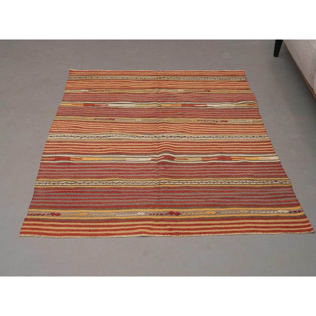 Vintage Hand-Knotted runner rug is a semi-antique vintage area rug. The '70s Eastern region of Anatolia's unique rug is...