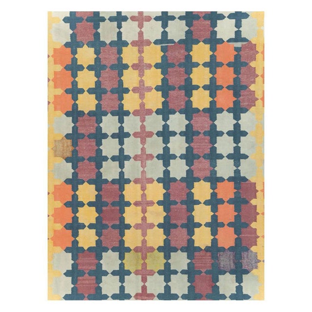 A vintage Indian flatweave Dhurrie room size carpet handmade during the mid-20th century. Measures: 10' 0" x 14' 11".