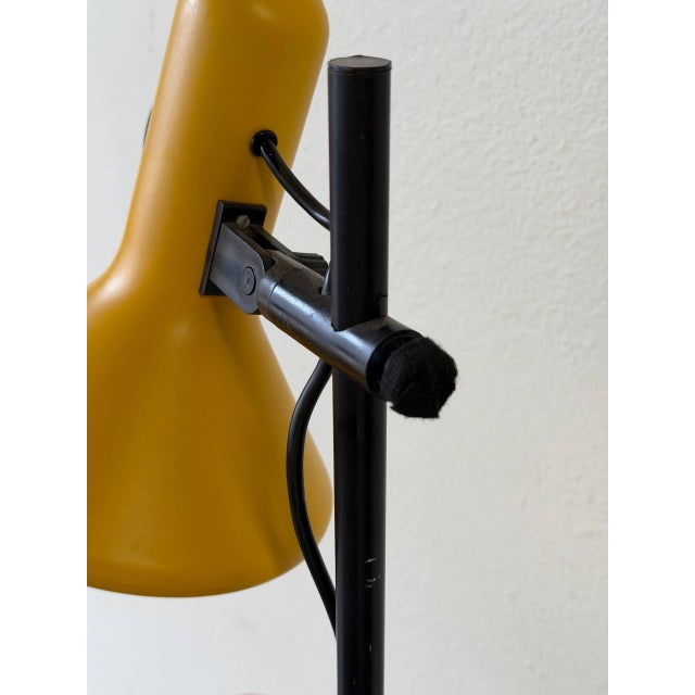 Vintage Danish Mid-Century Modern floor lamp by RUMA, made in Denmark. This striking lamp features two bright yellow metal...
