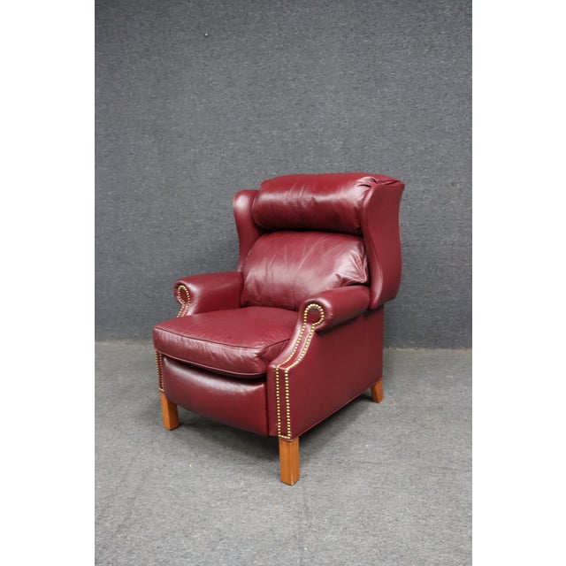 Classic Hancock & Moore reclining lounge chair upholstered in rich burgundy top-grain leather with solid hardwood legs and...