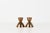 Pair of vintage copper taper candleholders in a sculptural hourglass silhouette, with a rounded cup rising from a wide...