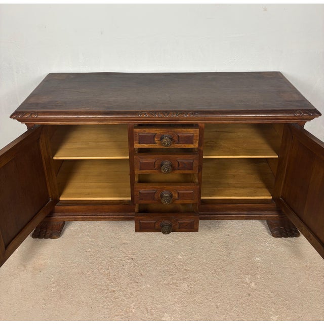 Impressive Spanish low sideboard crafted in oak, dating from the 20th century and inspired by traditional Renaissance...