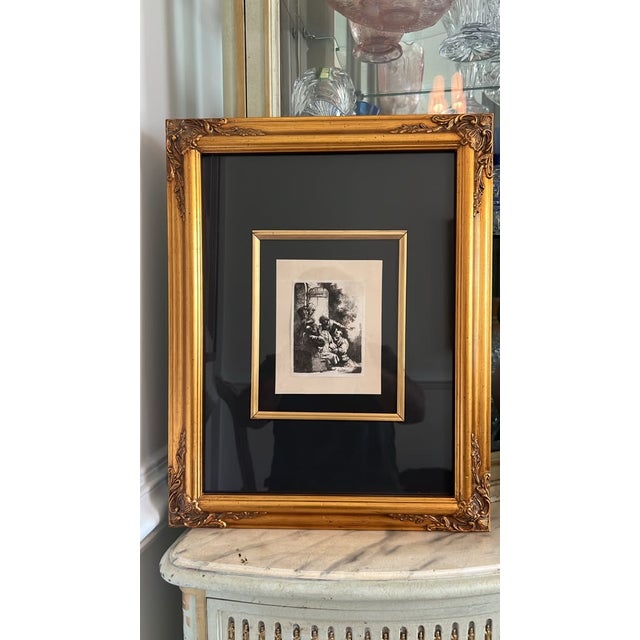 Elevate your space with this classical Rembrandt van Rijn black-and-white etching titled "Joseph's Coat Brought to Jacob."...