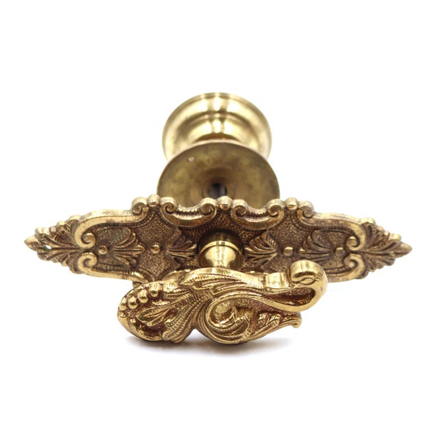 Victorian style unique passage door handle set made of brass with a polished finish. One side features a swan motif lever...