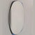 An elegant 1970s Italian Cristal Art mirror, featuring a cobalt blue curved glass frame and a beveled centerpiece. The...