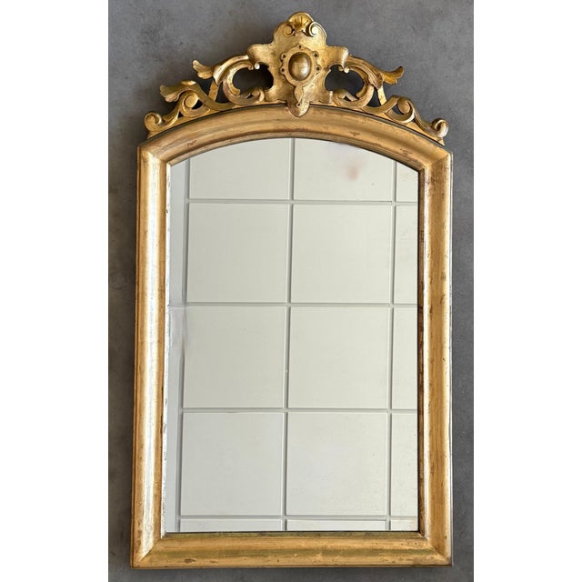 An exceptional large scale mirror hand-crafted in France, this piece is vertical symmetrical and the original mirror plate...