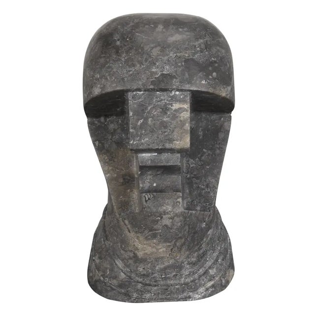 Carved from solid black marble, its striking presence is enhanced by natural veining, making each piece unique.