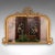 This is a large antique overmantle mirror. An English, giltwood and mercury glass lounge mirror, presenting distinctive...