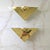 A pair of vintage electric wall sconces featuring Art deco style lucite and brass design.