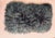 A plush, richly textured lumbar pillow in a beautiful teal blue-gray. The front is covered in long, curly fleece, while...