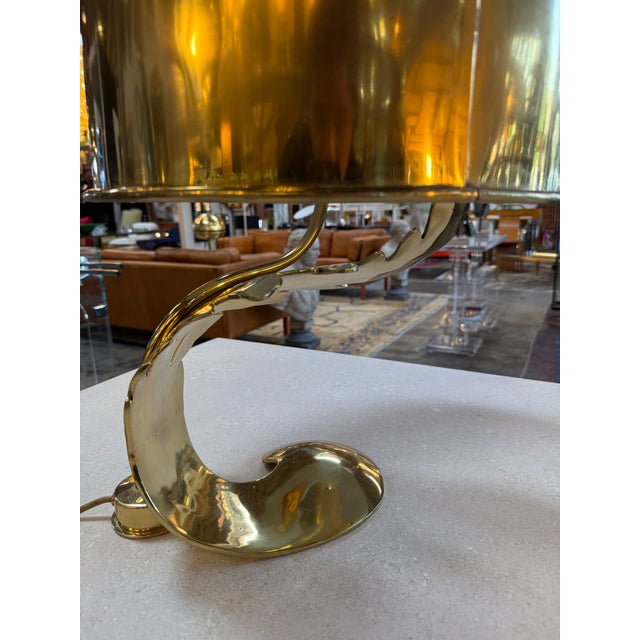 Expressive Italian table lamp from the 1970s, defined by its sculptural brass base formed as a flowing, organic leaf...