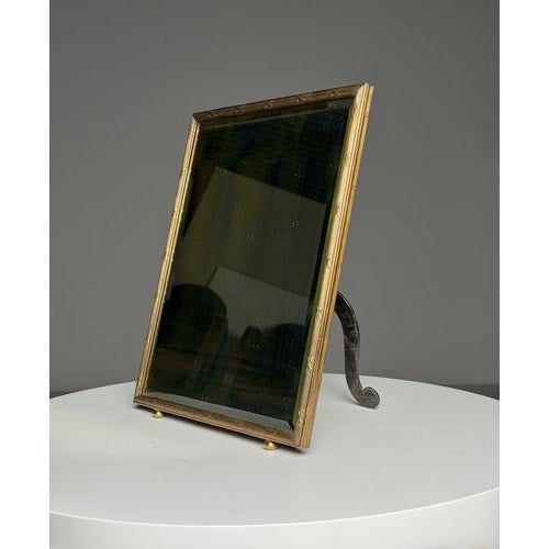 Mid-century makeup mirror. Frame made of brass. Glass beautifully slightly weathered. Dimensions: 35H x 30W x 18D