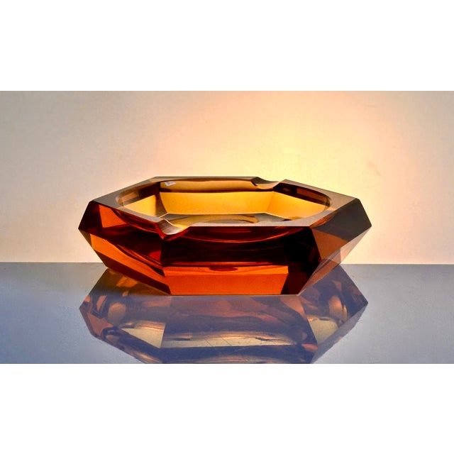 A superb example of early 20th‑century Bohemian glass artistry, this hexagonal amber crystal ashtray embodies the refined...