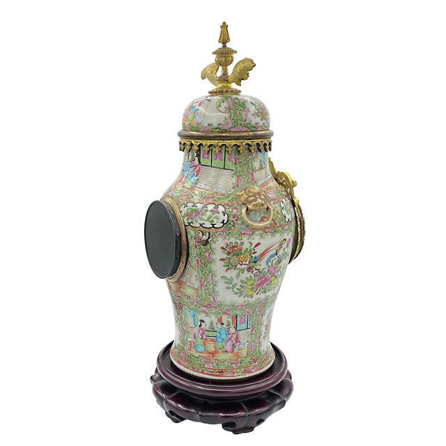 French pendulum clock with a Canton famille rose porcelain case, decorated with court scenes alternating with floral and...