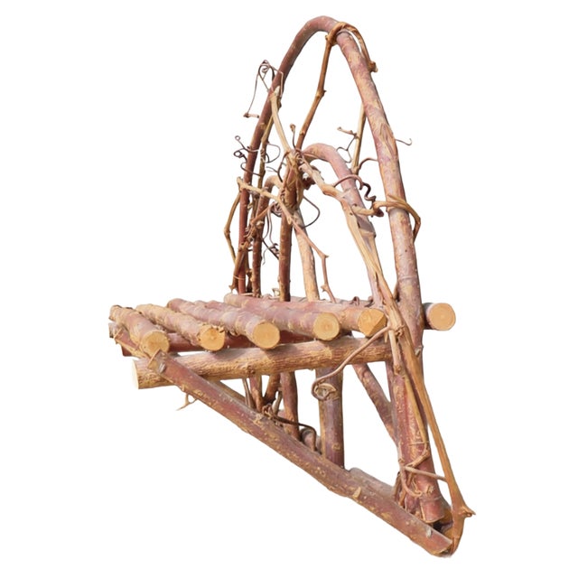Charming natural twig wall shelf comprised of bentwood arched backpiece and log-style cut twig shelf. Perfect in the...