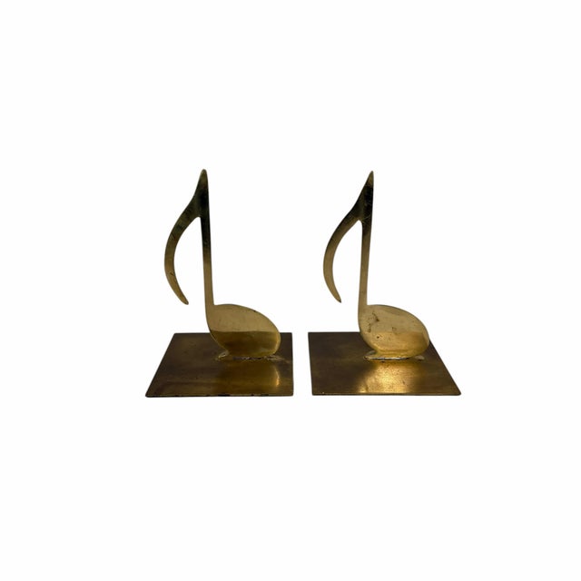 Vintage music note bookends. Nice addition for the music lover. Measure 4” square x 6” h. Minor tarnish.