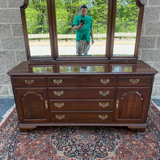 A late 20th century Ethan Allen Georgian Court collection Traditional Solid cherry lowboy triple dresser and attached...