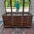 A late 20th century Ethan Allen Georgian Court collection Traditional Solid cherry lowboy triple dresser and attached...