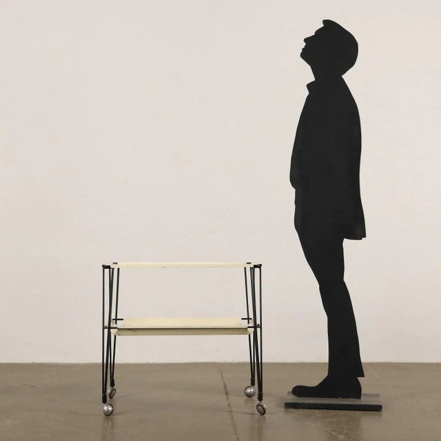 Service Trolley. Enamelled Metal. This piece is attributed to the mentioned designer/maker. It has no attribution mark and...